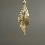 MET-00054: 16 x 49mm Antique Brass Wavy Leaf Charm 